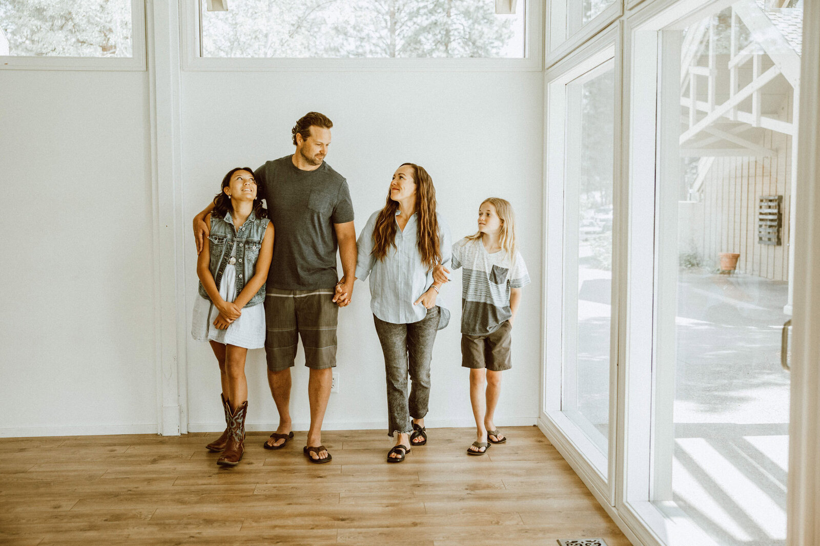 The Johnson family in their bright, windowed home