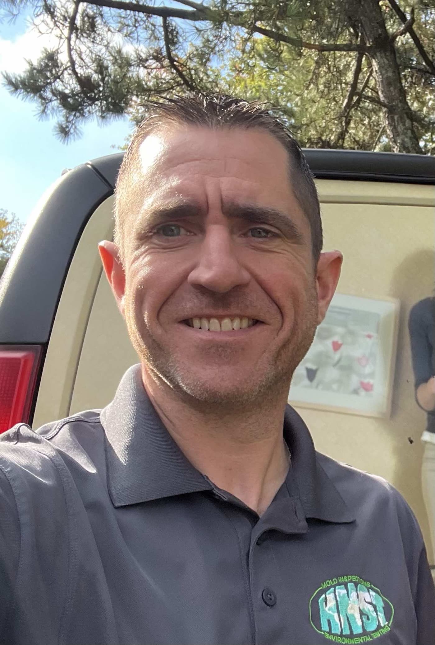 John Skelly, founder of HNST Environmental, in branded company polo outdoors