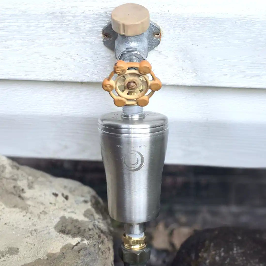 Natural Action Garden Revitalizer installed on outdoor spigot
